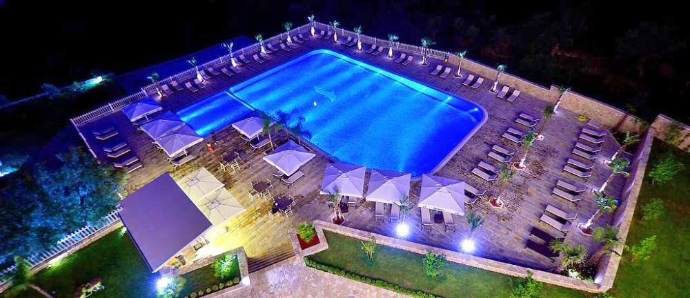 elysium hotel swimming pool by night